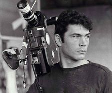 Robert Forster as he appeared as the cameraman in Haskell Wexler’s Medium Cool - hailed as 
 “guerrilla-filmmaking confronts traditional Hollywood practices.” 